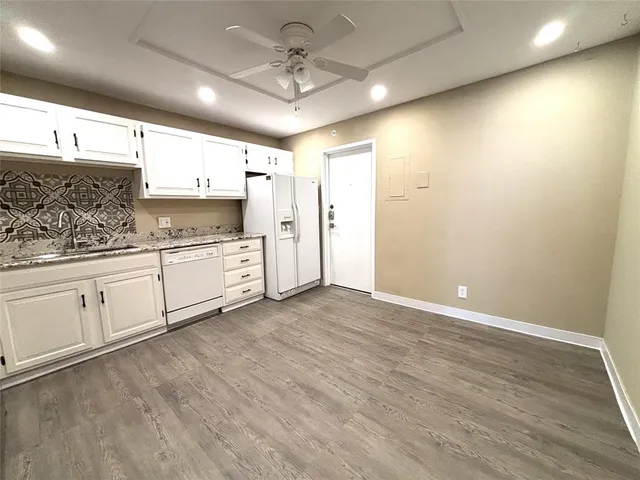 a view of a kitchen with electric appliances