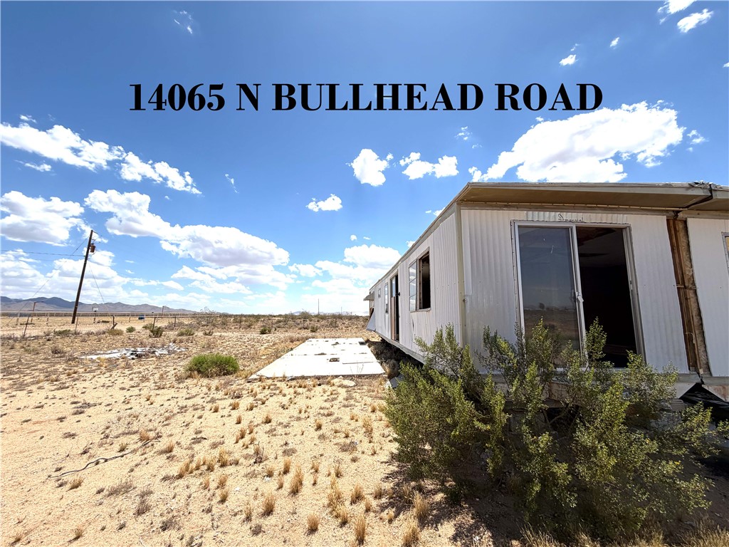 14065 Bullhead Road Dolan Springs, AZ 86441 - Photo 1 of 8 a view of a entrance to house