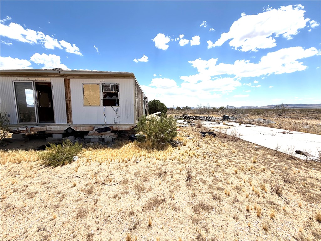 14065 Bullhead Road Dolan Springs, AZ 86441 - Photo 3 of 8 a view of a house with a yard