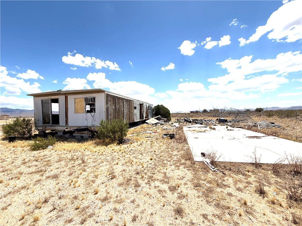14065 Bullhead Road Dolan Springs, AZ 86441 - Photo 4 of 8 a view of a house with a yard and covered with snow