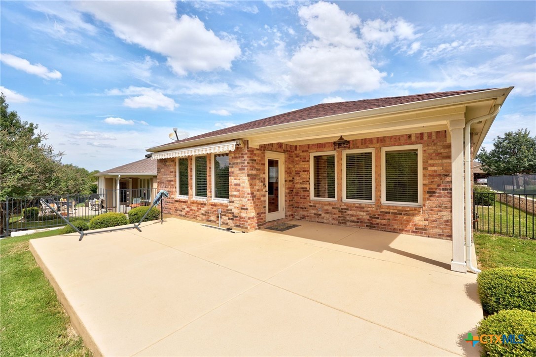 309 Kickapoo Creek Lane Georgetown, TX 78633 - Photo 27 of 28 a view of house with yard and glass windows
