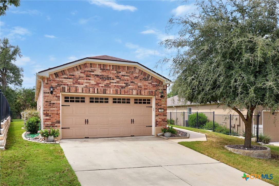 309 Kickapoo Creek Lane Georgetown, TX 78633 - Photo 4 of 28 a view of a house with a garden