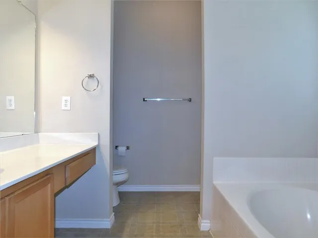 a bathroom with a sink a toilet and bathtub