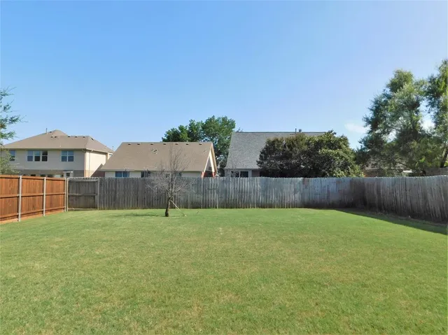 a view of a yard in front of a house