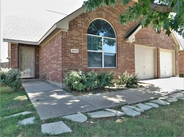 a front view of a house with yard