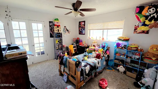 a bed room with a bed and a window