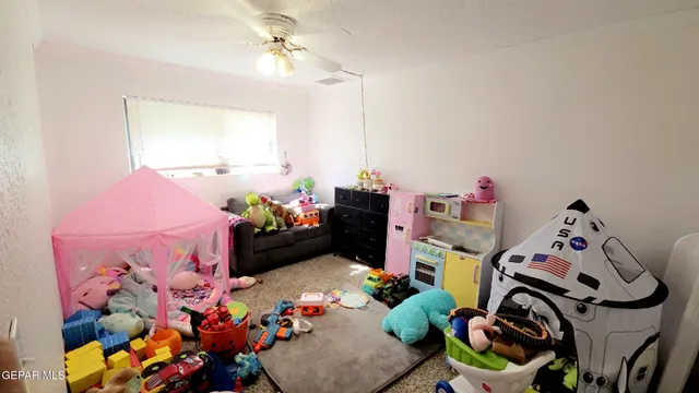 a bed room with a bed and a dresser