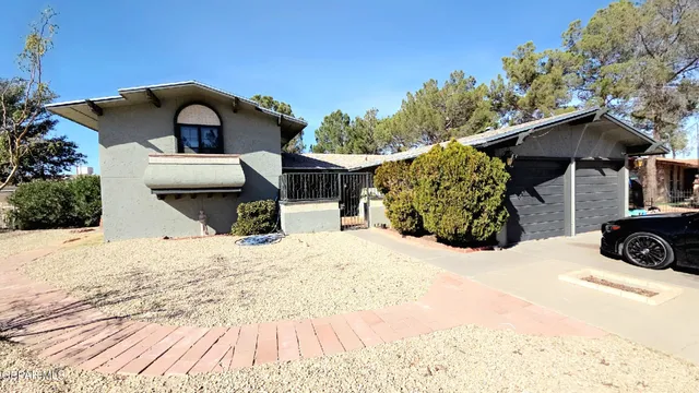 a view of a house with a snow in the yard