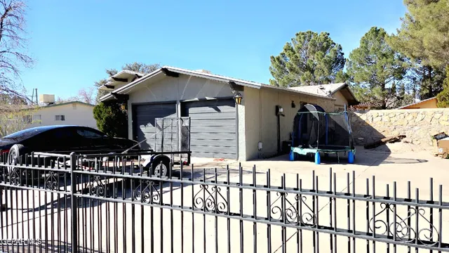 a view of house with street and trees