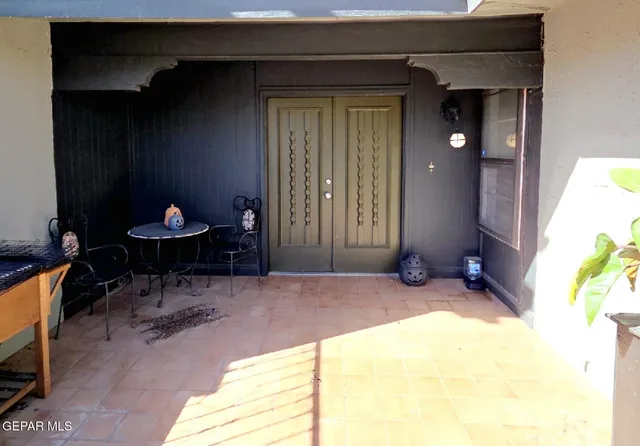 a view of a chairs and table in a room