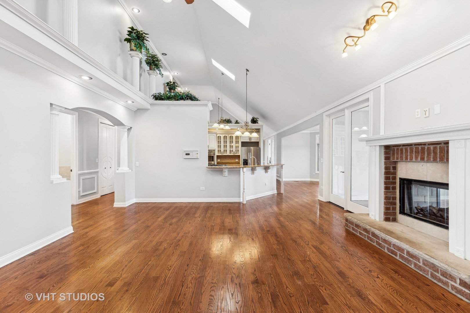 26711 South Anna Lane Monee, IL 60449 - Photo 14 of 43 a view of empty room with wooden floor and fireplace