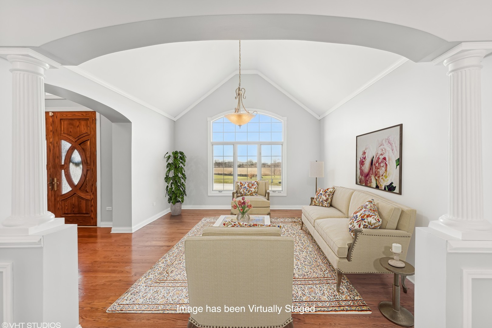 26711 South Anna Lane Monee, IL 60449 - Photo 22 of 43 a living room with furniture and a chandelier