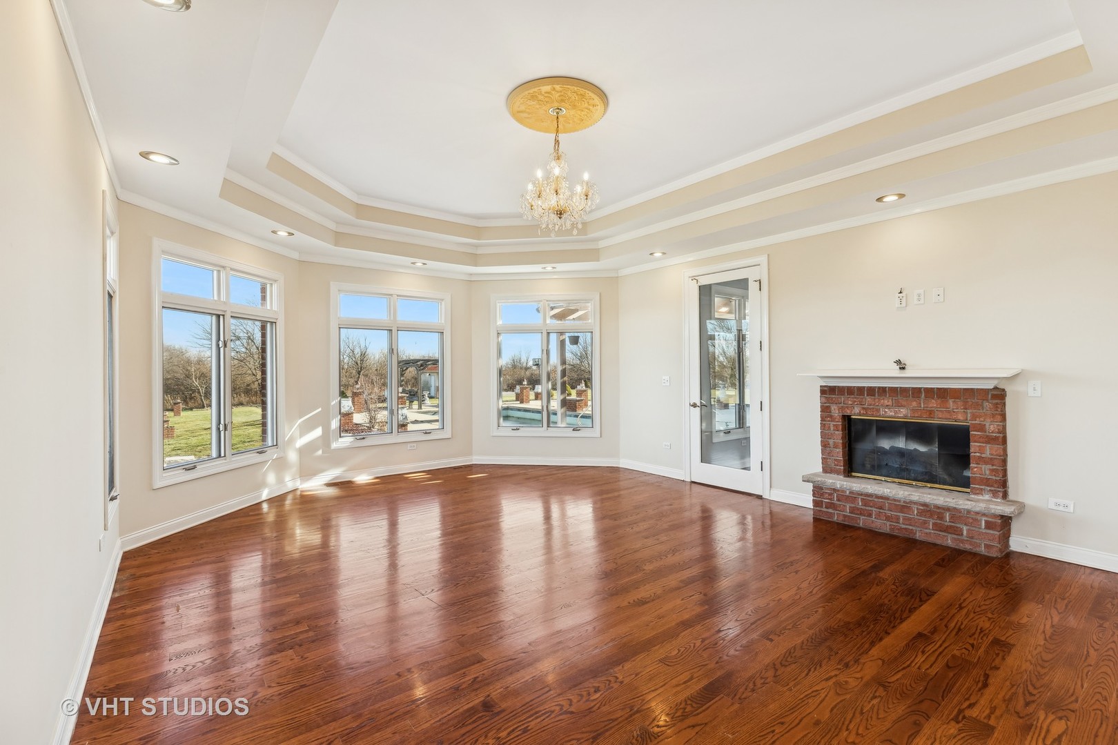 26711 South Anna Lane Monee, IL 60449 - Photo 25 of 43 a view of an empty room with wooden floor fireplace and a window