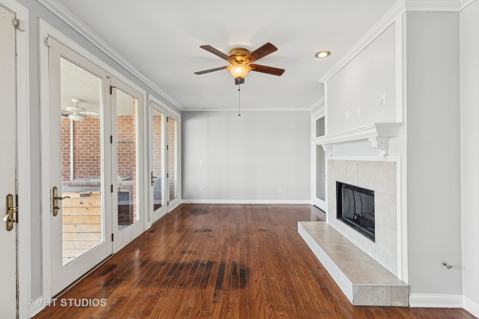 26711 South Anna Lane Monee, IL 60449 - Photo 31 of 43 a view of a livingroom with wooden floor a fireplace and window