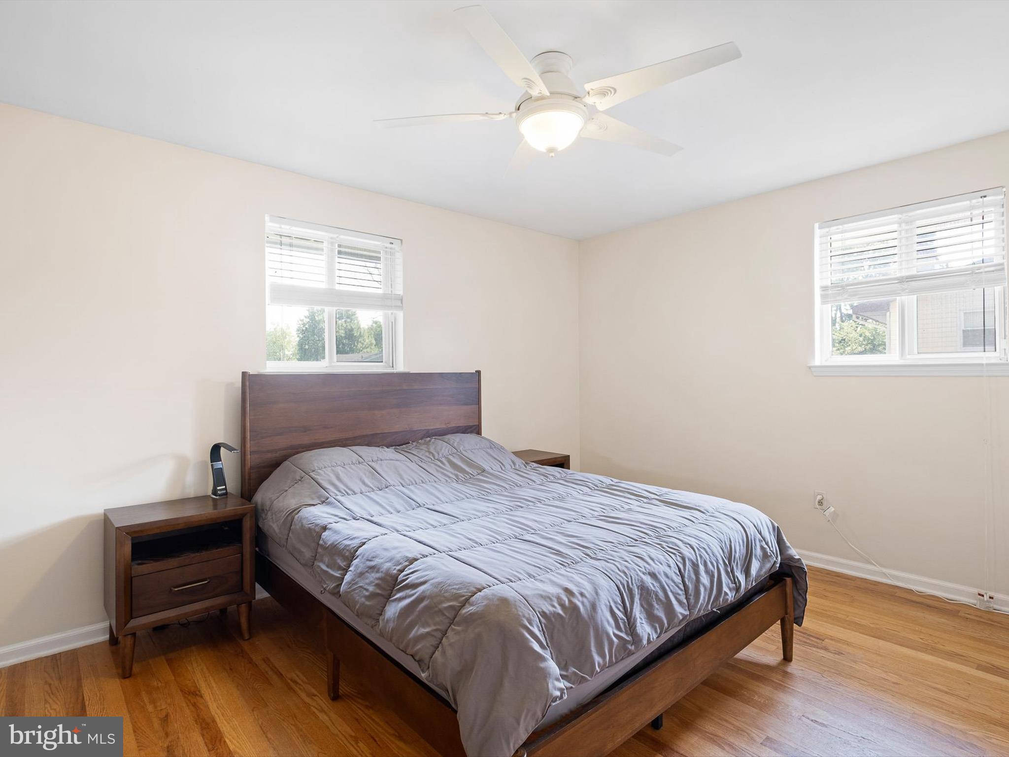 508 Garrick Road Hockessin, DE 19707 - Photo 16 of 25 a bedroom with a bed wooden floor and window