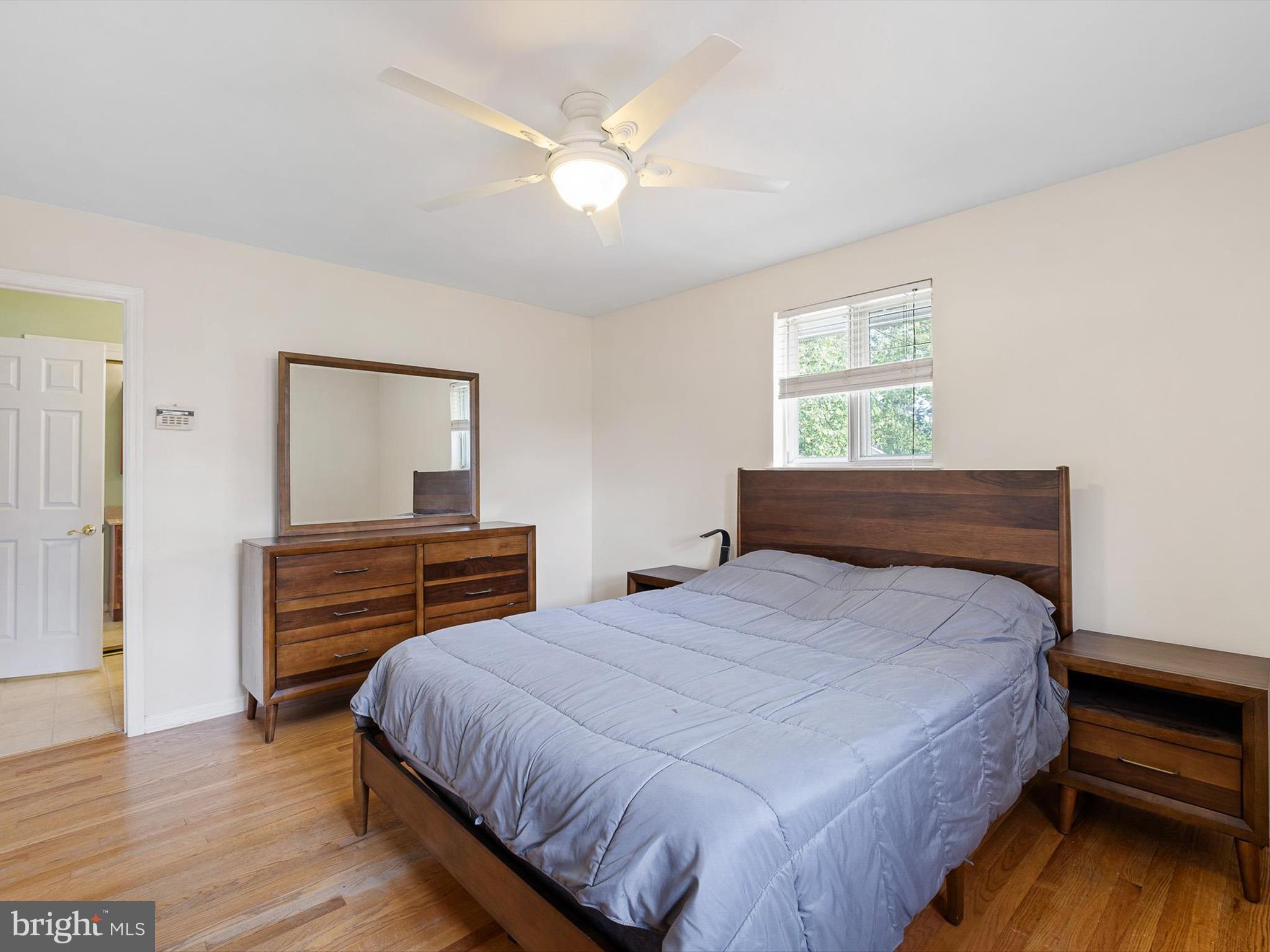 508 Garrick Road Hockessin, DE 19707 - Photo 17 of 25 a bedroom with a bed and a dresser