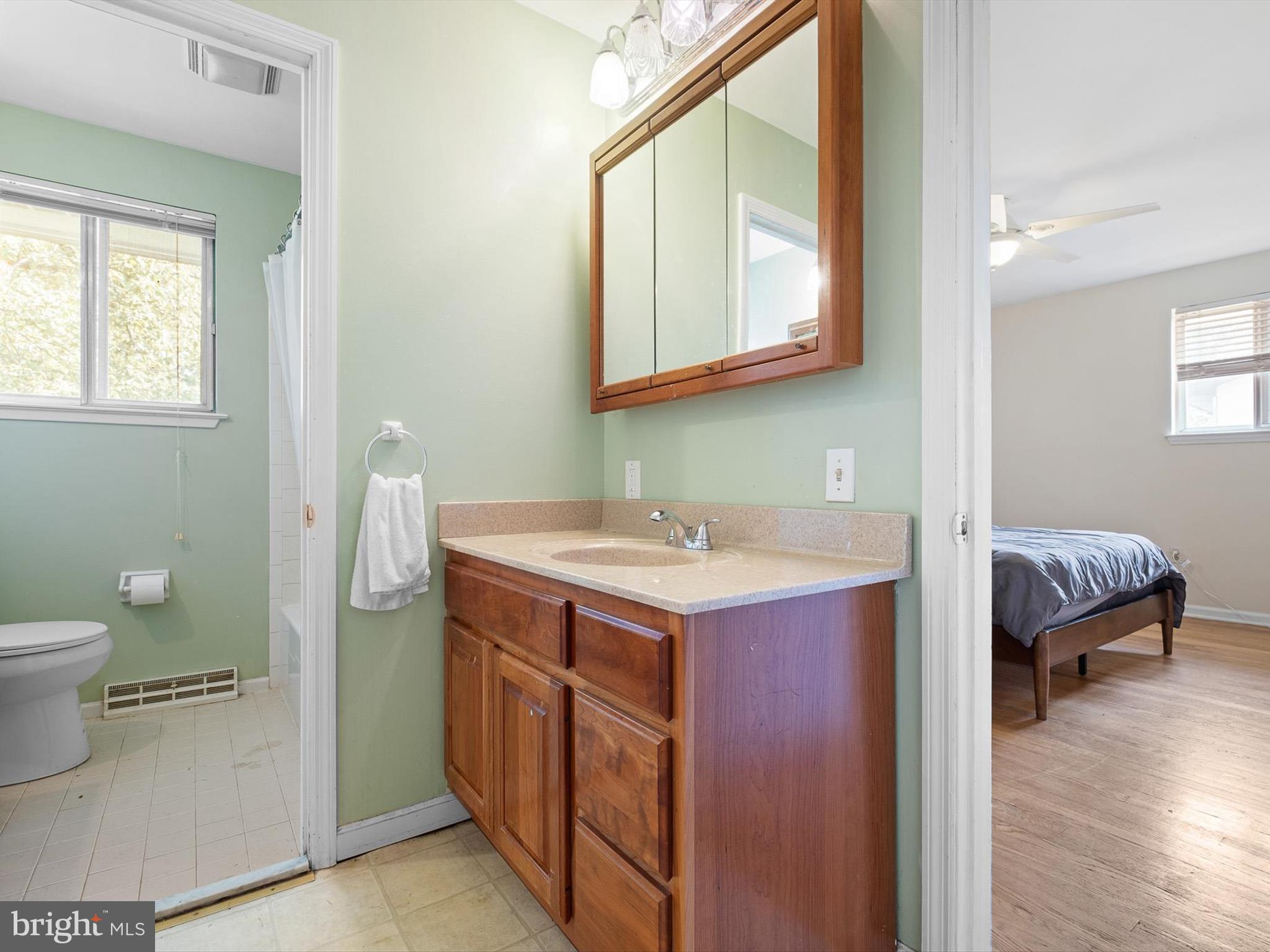 508 Garrick Road Hockessin, DE 19707 - Photo 19 of 25 a bathroom with a sink and a mirror
