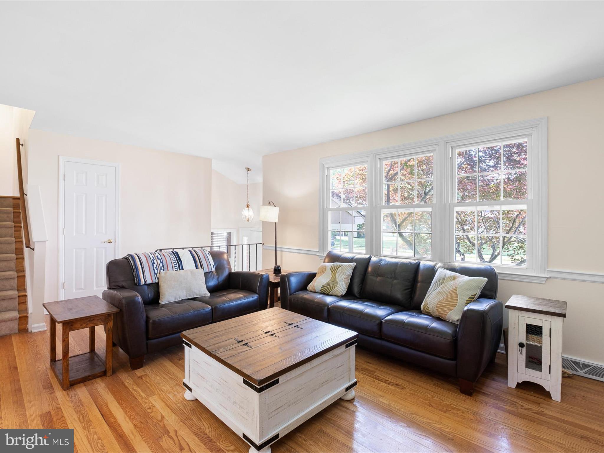 508 Garrick Road Hockessin, DE 19707 - Photo 4 of 25 a living room with furniture and a wooden floor