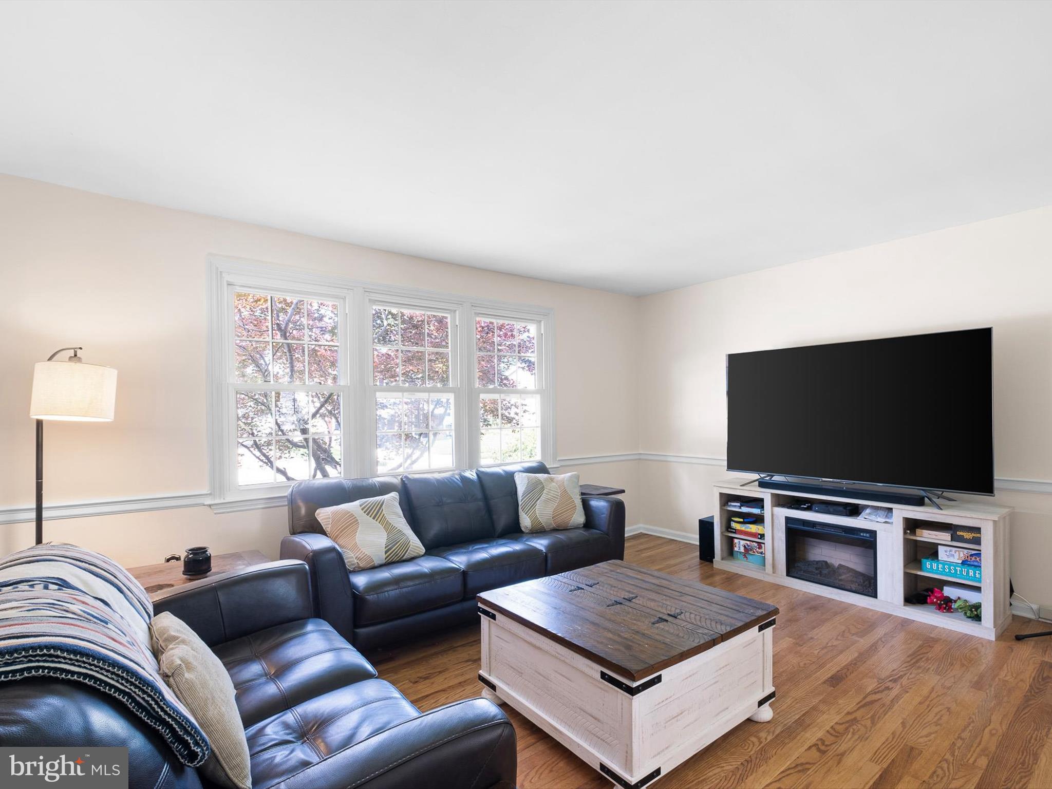 508 Garrick Road Hockessin, DE 19707 - Photo 5 of 25 a living room with furniture and a flat screen tv