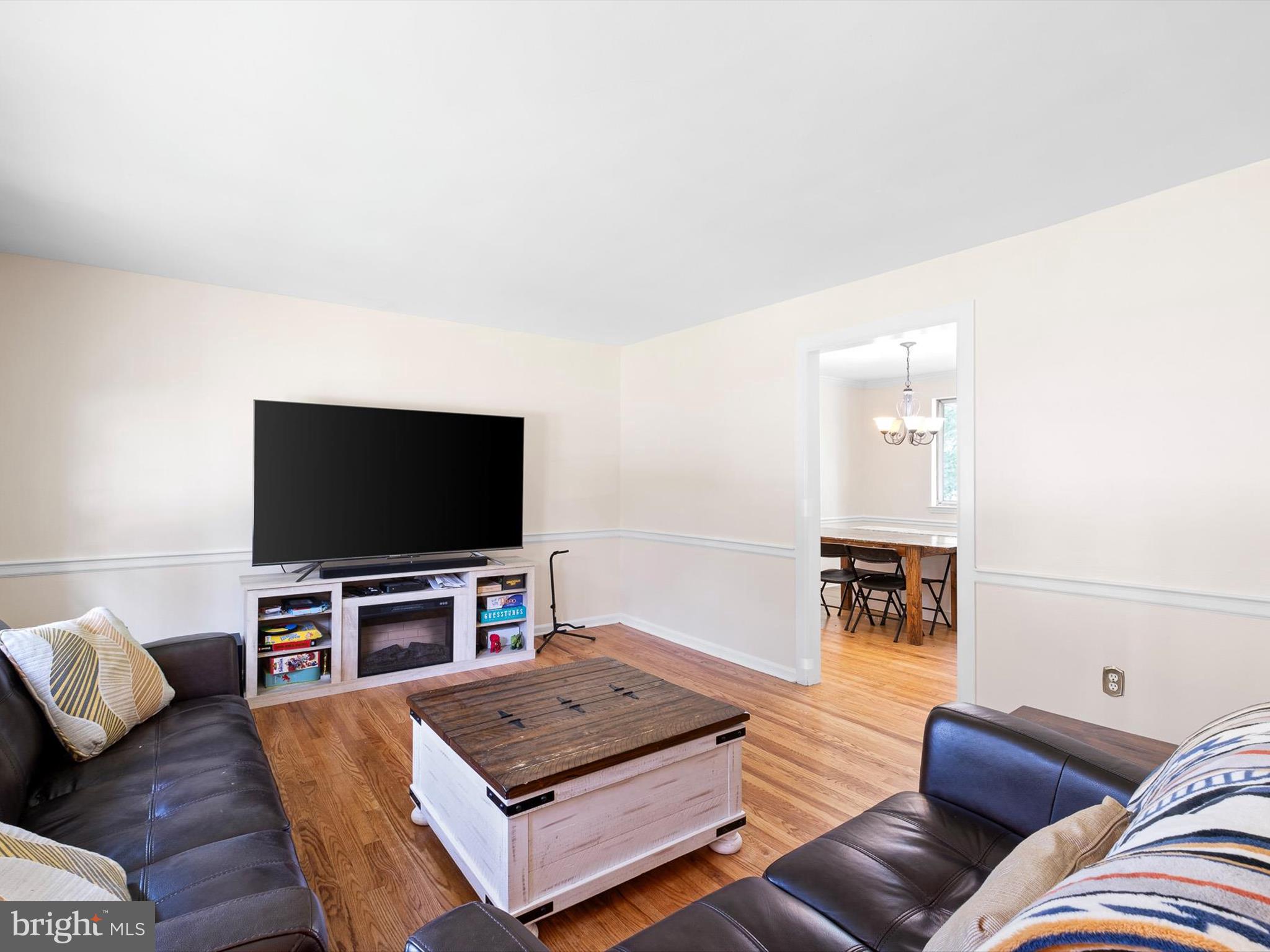 508 Garrick Road Hockessin, DE 19707 - Photo 6 of 25 a living room with furniture and a flat screen tv