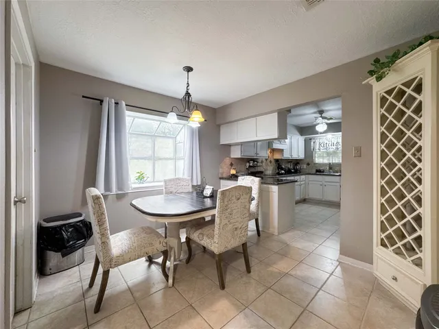 a kitchen with a sink and a refrigerator