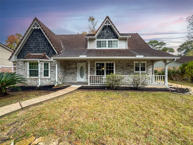 front view of a house with a yard