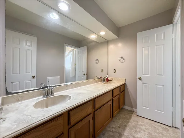 a white toilet sitting next to a shower