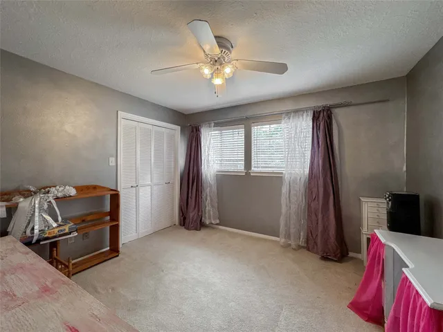 a living room with furniture a fireplace and a chandelier