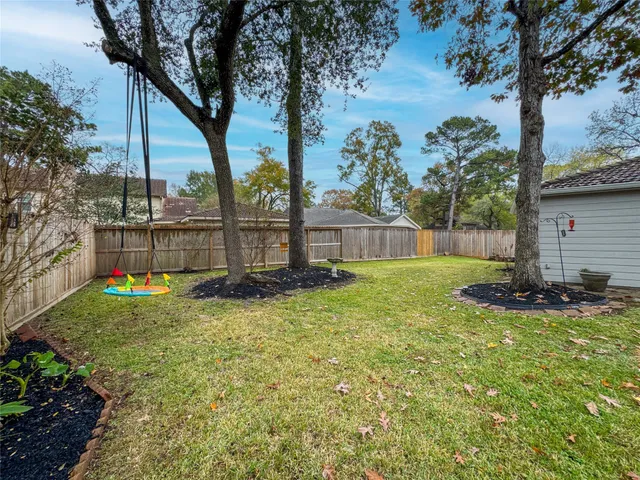 a view of a backyard with a garden