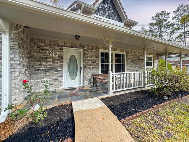 a front view of a house with a porch