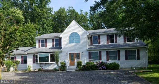 5901 Shady Spring Avenue Baltimore, MD 21237 - Photo 2 of 30 a front view of a house with plants and trees