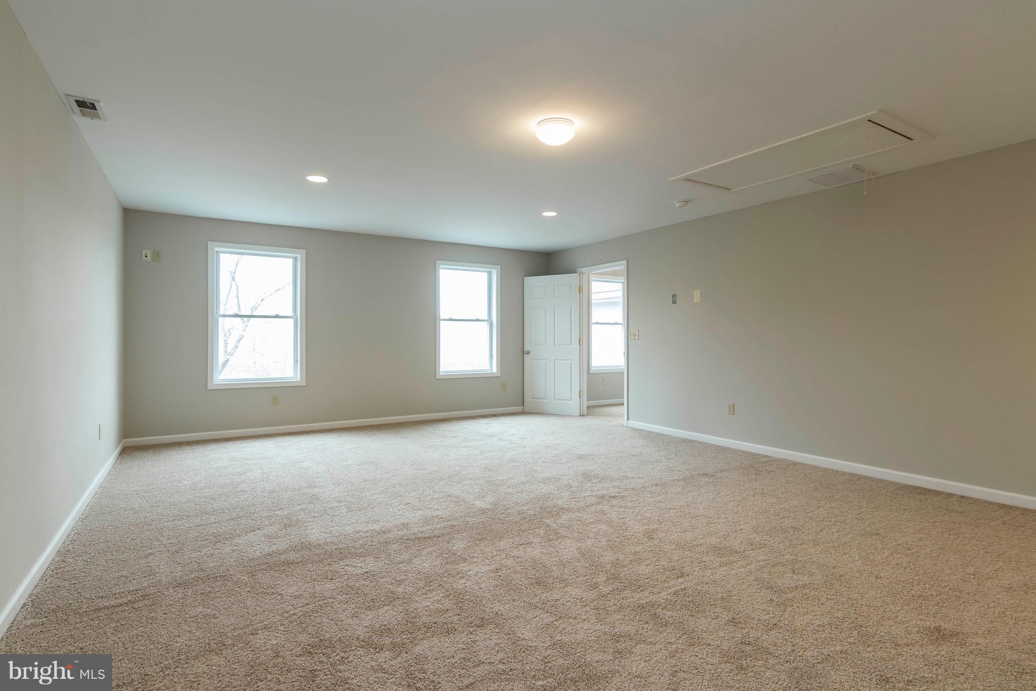5901 Shady Spring Avenue Baltimore, MD 21237 - Photo 21 of 30 an empty room with windows