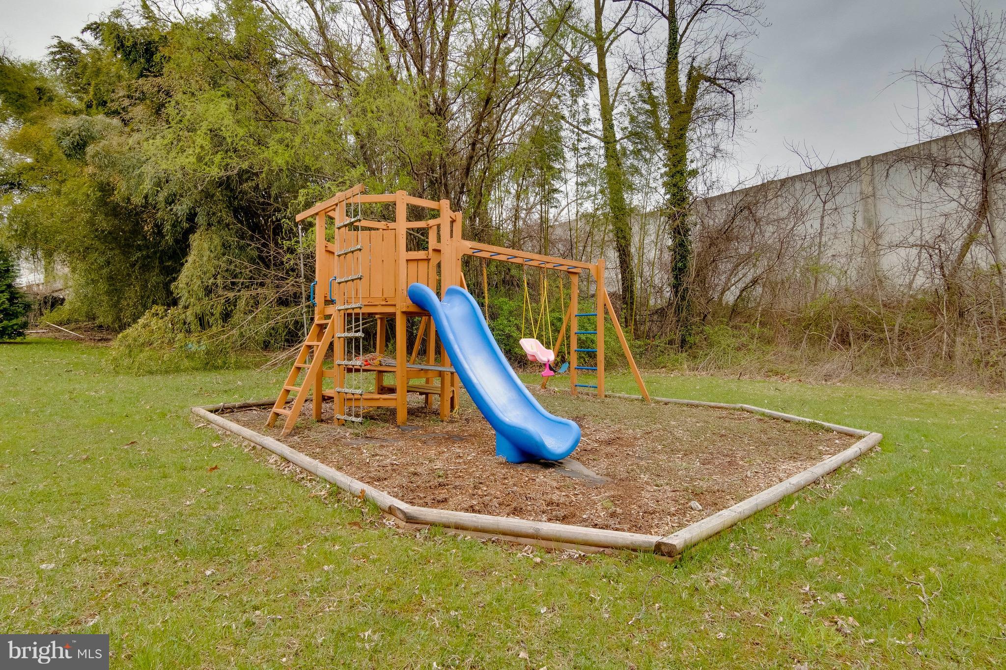 5901 Shady Spring Avenue Baltimore, MD 21237 - Photo 25 of 30 a view of a park with a slide
