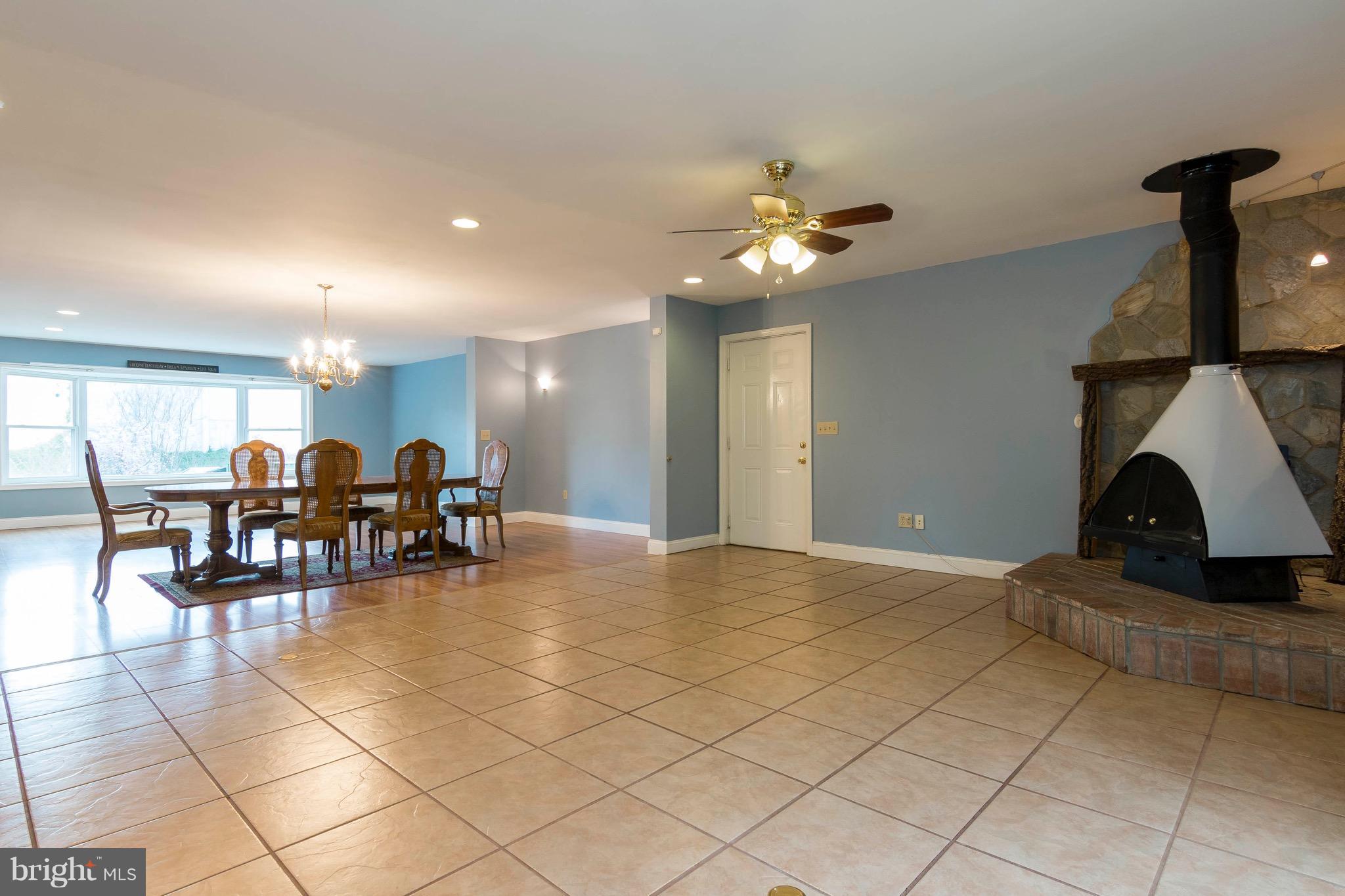 5901 Shady Spring Avenue Baltimore, MD 21237 - Photo 6 of 30 a view of a livingroom with furniture and a chandelier