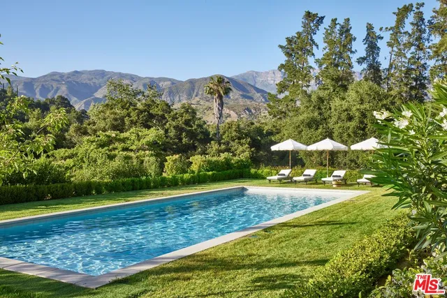 a view of a yard with an outdoor space and seating