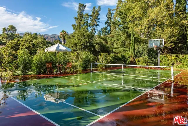 a view of a wooden house with a yard