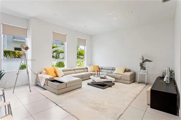 a living room with furniture and window