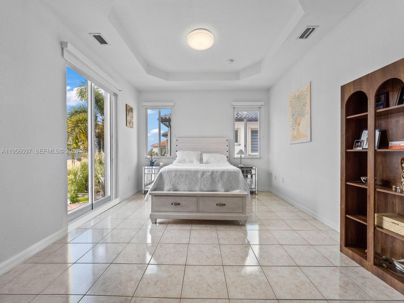 15383 Southwest 23rd Street Miami, FL 33185 - Photo 14 of 36 a bedroom with a bed and a window