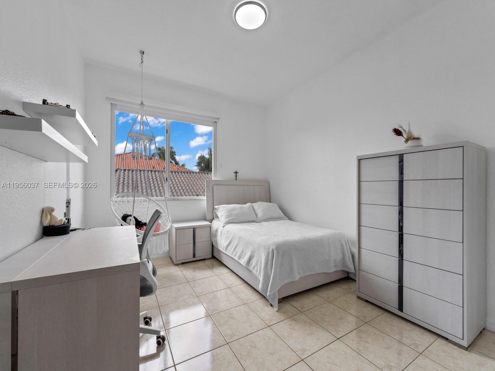 15383 Southwest 23rd Street Miami, FL 33185 - Photo 19 of 36 a bedroom with a bed and a window