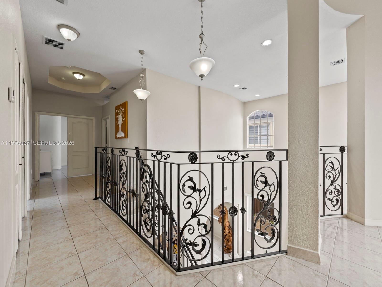 15383 Southwest 23rd Street Miami, FL 33185 - Photo 24 of 36 a view of a hallway with a couple of white walls