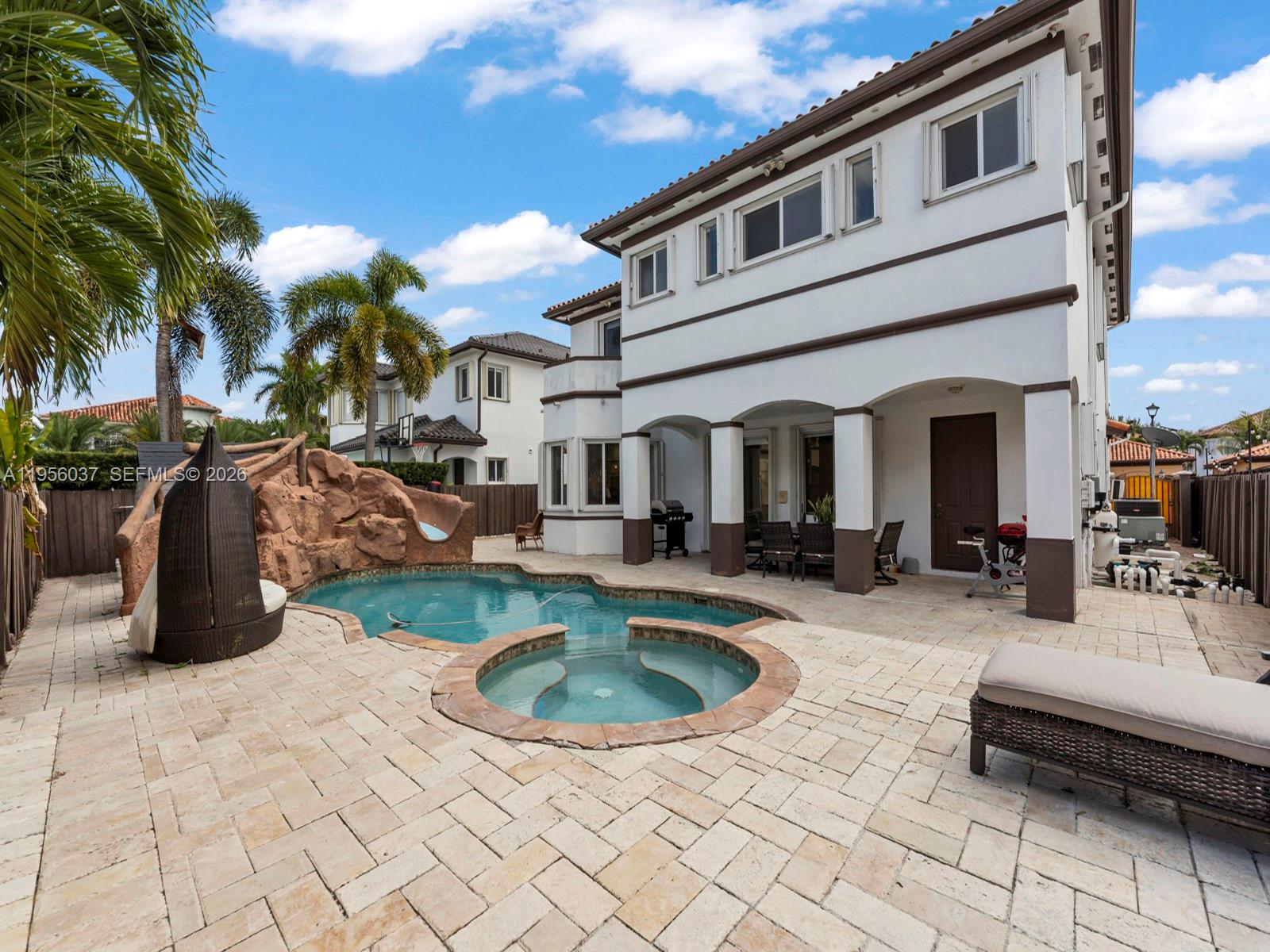 15383 Southwest 23rd Street Miami, FL 33185 - Photo 29 of 36 a view of a house with backyard and sitting area