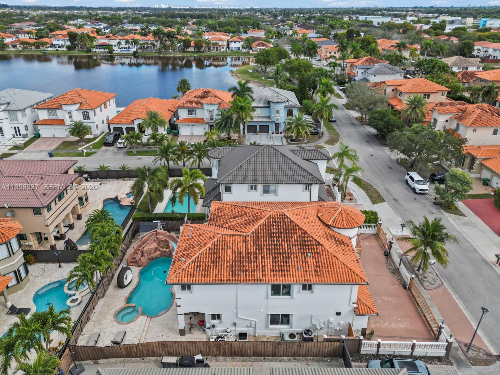 15383 Southwest 23rd Street Miami, FL 33185 - Photo 36 of 36 an aerial view of a house with outdoor space and lake view