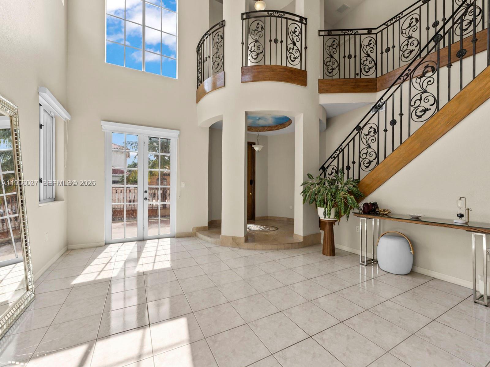 15383 Southwest 23rd Street Miami, FL 33185 - Photo 5 of 36 a view of entryway and hall with wooden floor