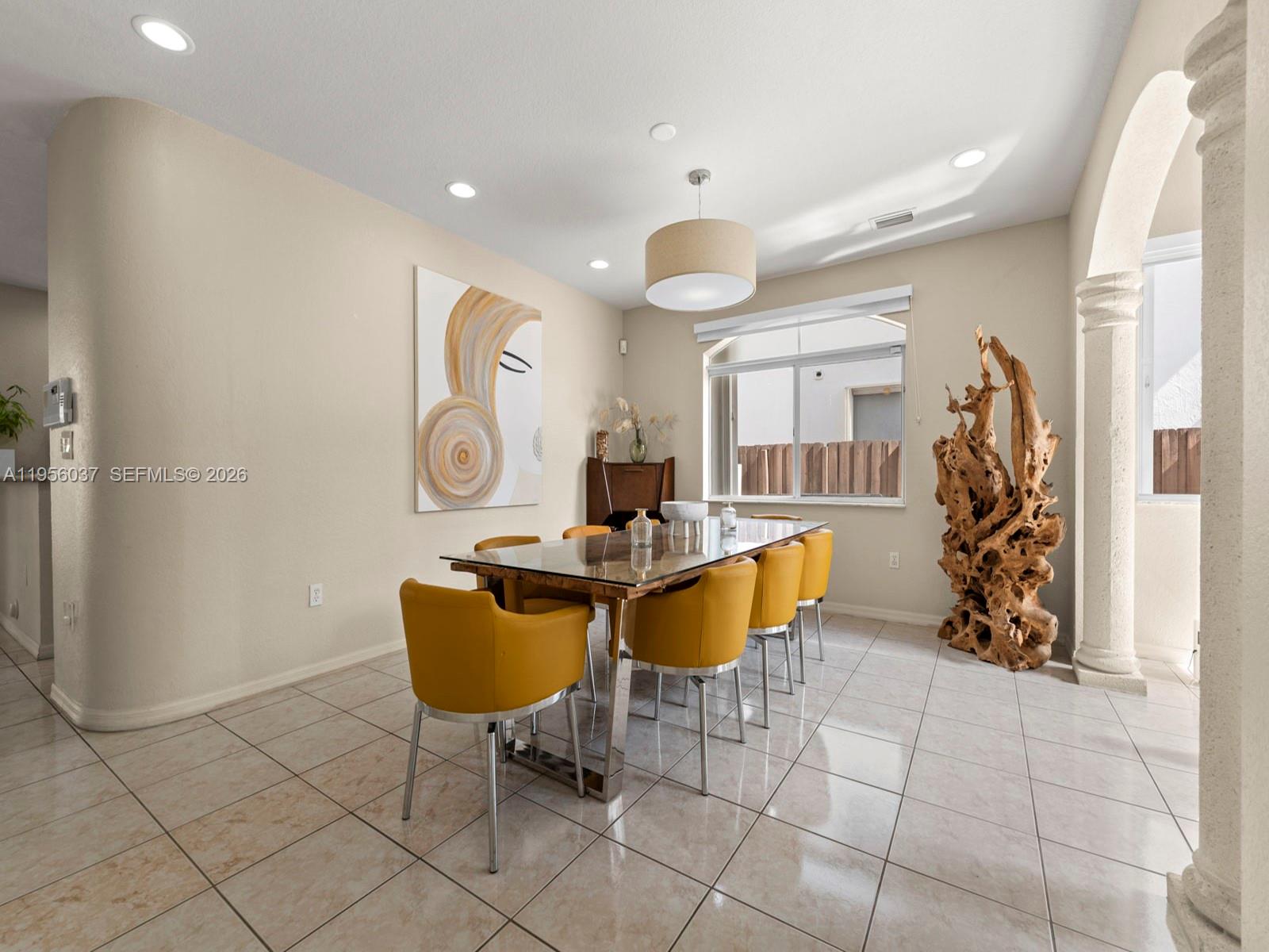 15383 Southwest 23rd Street Miami, FL 33185 - Photo 7 of 36 a living room with furniture and a painting on the wall