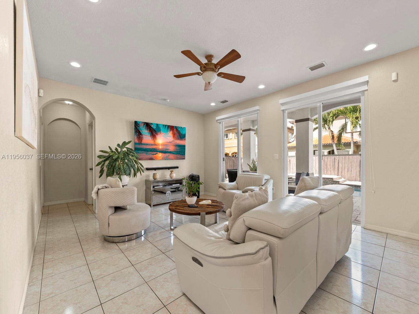 15383 Southwest 23rd Street Miami, FL 33185 - Photo 9 of 36 a living room with furniture and a flat screen tv