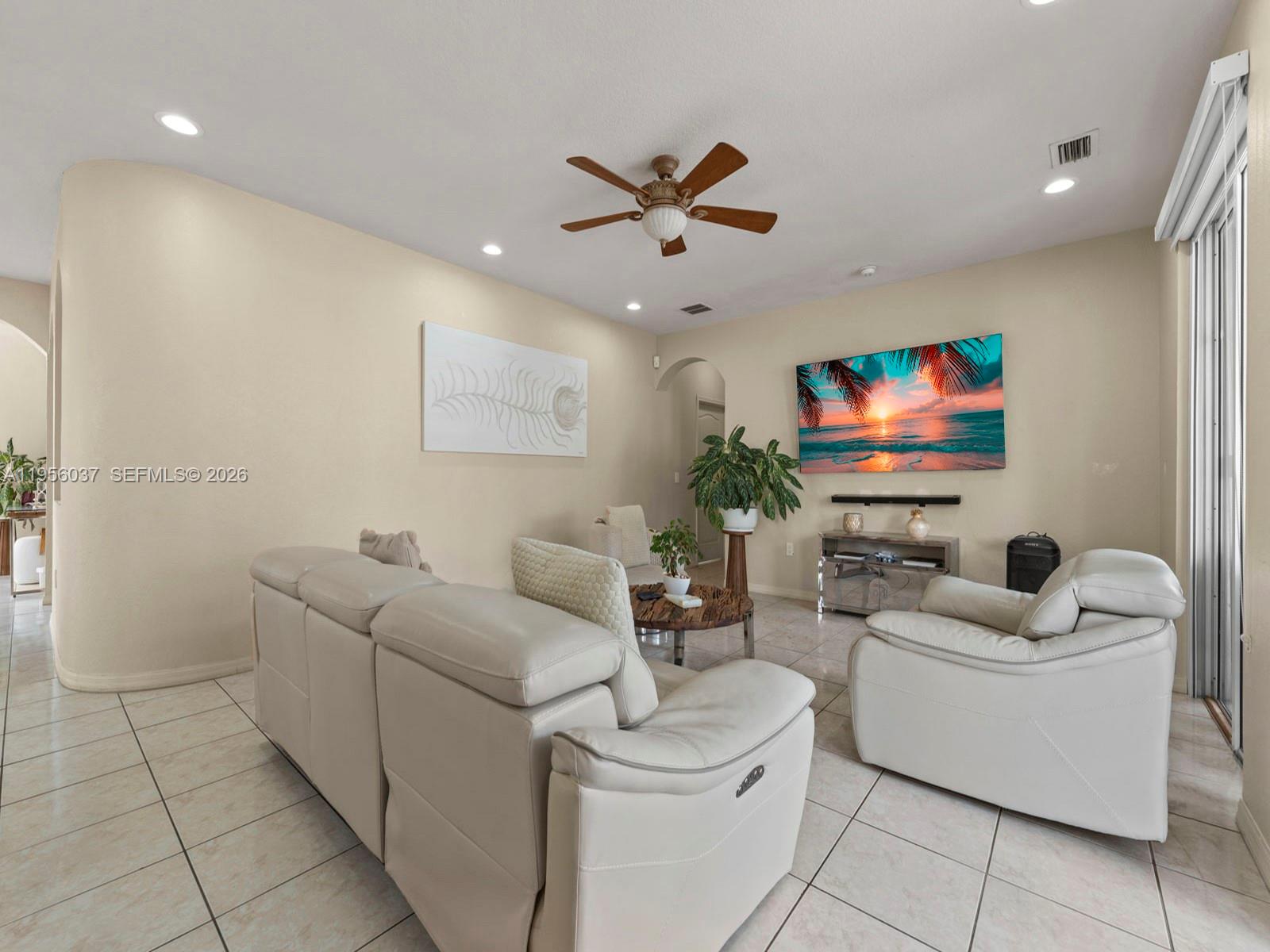15383 Southwest 23rd Street Miami, FL 33185 - Photo 10 of 36 a living room with furniture and a flat screen tv