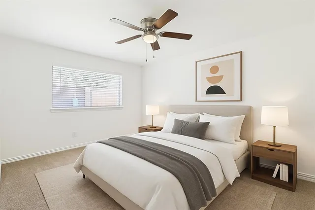 a bedroom with bed and window