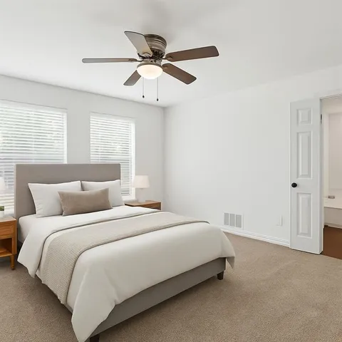 a bedroom with a bed and window