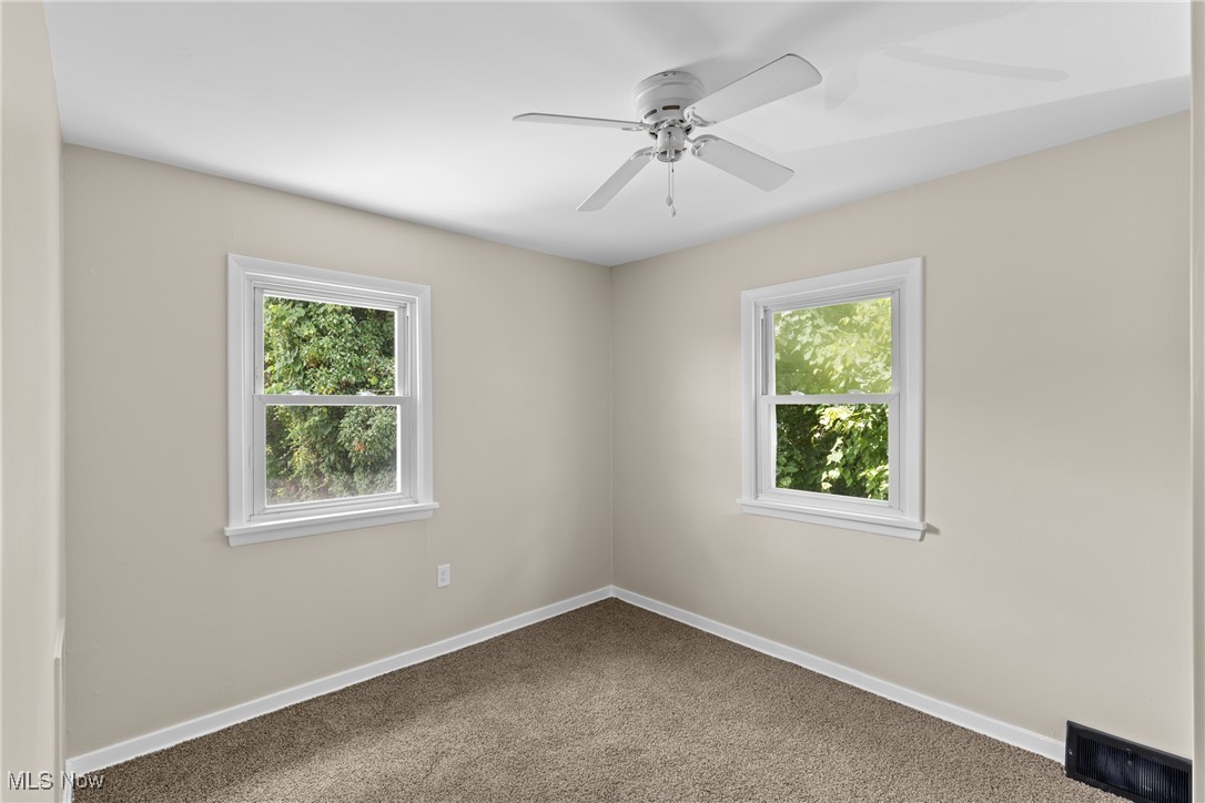 60880 Webb Heights Road Shadyside, OH 43947 - Photo 13 of 31 Empty room with carpet flooring and a ceiling fan