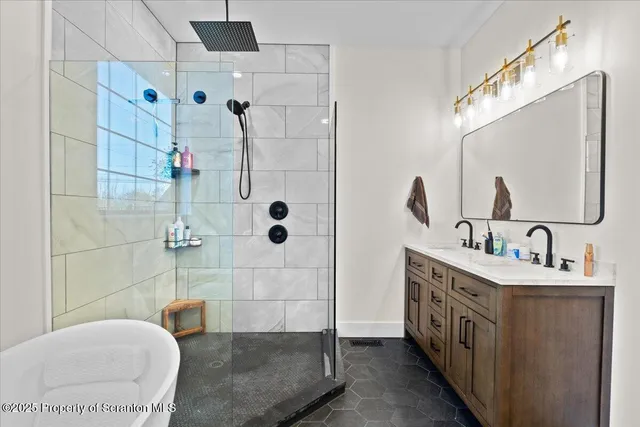 a white bath tub sitting in a bathroom